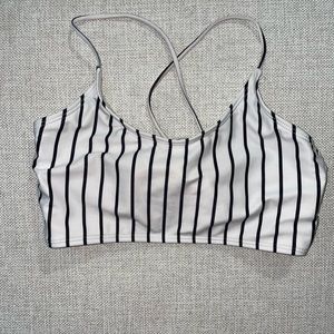 Black and white striped lace-up bikini top.